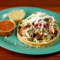Sope  · Masa Shells (ground corn) topped with your choice of meat or grilled vegetables, refried bea...