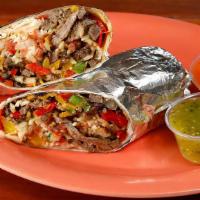 Super Steak Fajita Burrito · Grilled steak sautéed with bell peppers and onions, your choice of beans, and rice, Monterey...