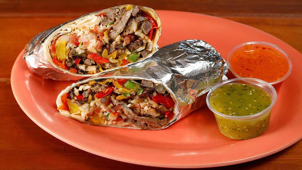 Super Steak Fajita Burrito · Grilled steak sautéed with bell peppers and onions, your choice of beans, and rice, Monterey jack cheese, salsa fresca, guacamole, and sour cream.