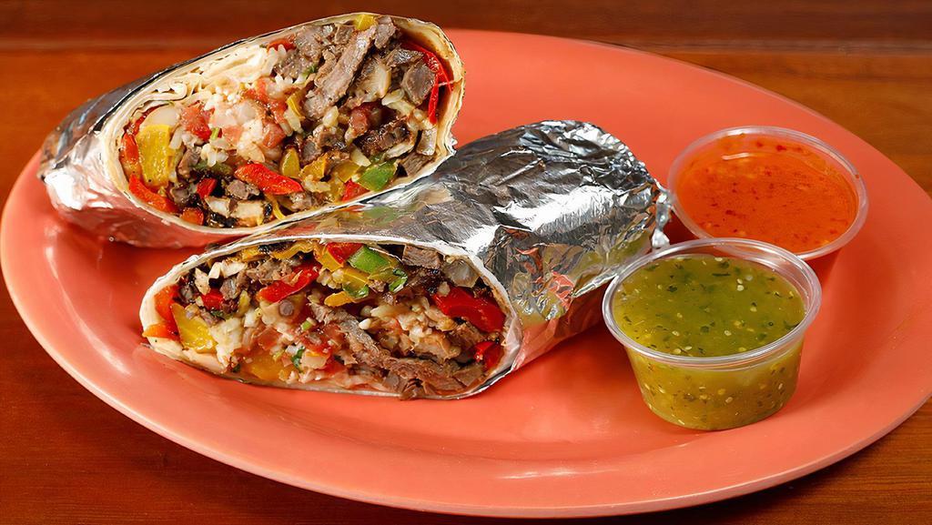 Regular Steak Fajita Burrito · Steak sautéed with bell peppers and onions, your choice of rice, and beans, Monterey jack cheese and salsa fresca.