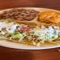 Crispy or Soft Taco (2) Plate Meat with Rice & Beans · Choice of meat, topped with lettuce, Mexican cheese, tomato sauce, sour cream and salsa fres...