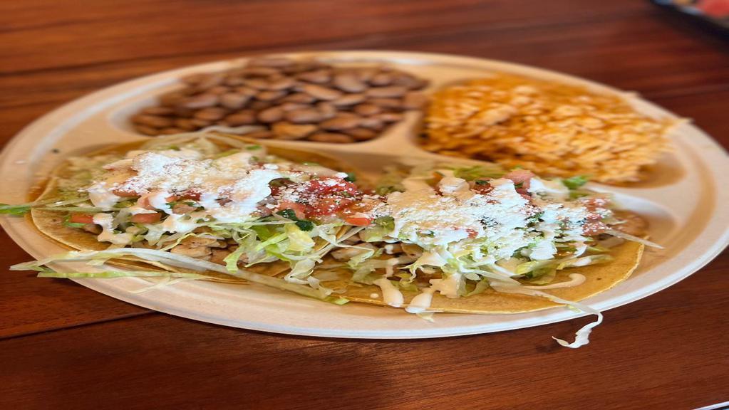 Crispy or Soft Taco (2) Plate Meat with Rice & Beans · Choice of meat, topped with lettuce, Mexican cheese, tomato sauce, sour cream and salsa fresca.