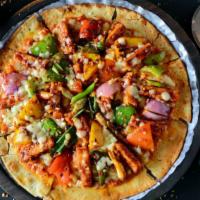Chili Paneer Pizza · Exquisite paneer pizza with chili sauce, garlic, ginger, diced red tomatoes, green chili, ch...