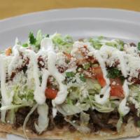 Huaraches · Choice of meat, lettuce, onion, cheese, cream, and sauce.
