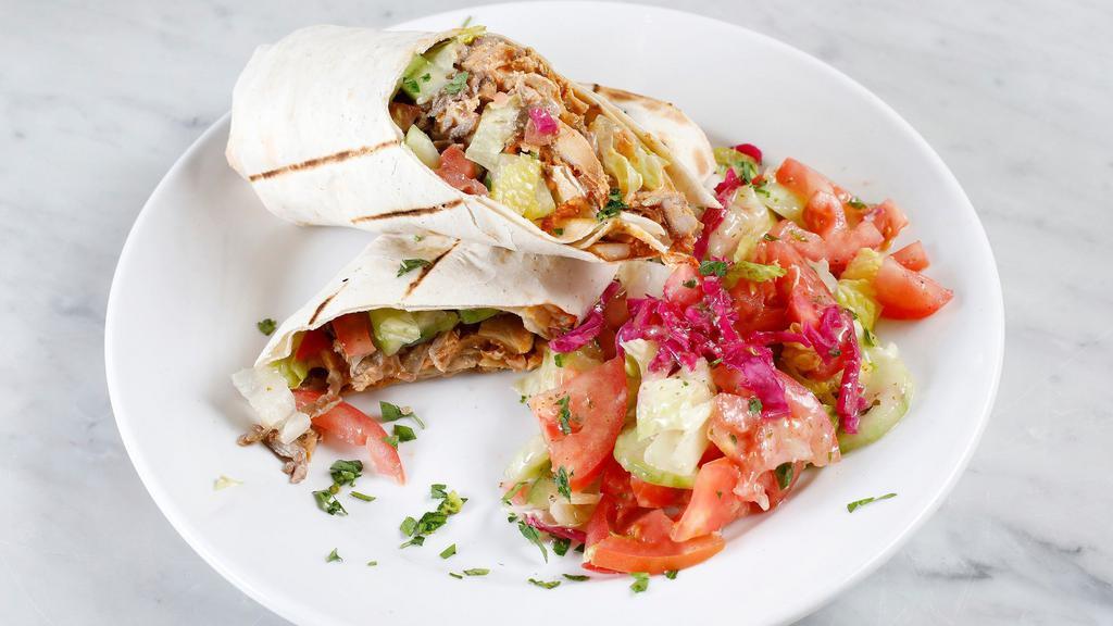 Combo Gyro Wrap · Daily cut and cooked lamb and beef meat and chicken meat gyro, tomatoes, cucumber, romaine hearts, tzatziki sauce wrapped in lavash bread and optional side of hot sauce(1.5oz)