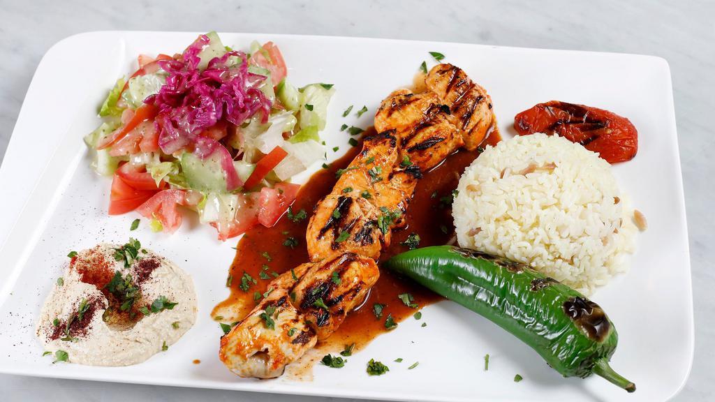 Chicken Shish Kebab Plate · Charbroiled grilled skewered chicken cubes. Served with rice, salad, pita bread, and hummus
