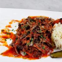 Alexander Kebab Plate · Seasoned thin sliced beef and lamb over bread cubes with marinara, yogurt, and butter. Serve...