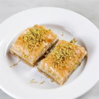 Baklava Pistachio · Golden brown fillo dough, with a layer of pistachios, topped with syrup. One order comes thr...
