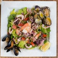 Fish Market Salad · Lettuce, marinated squid, prawns, octopus, clams and mussels.