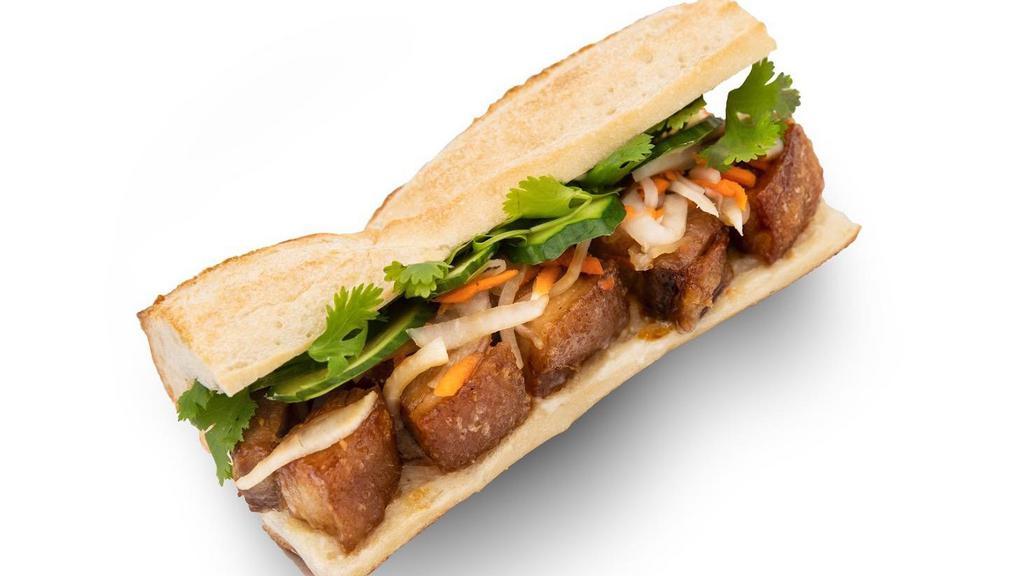 Crispy Pork Belly Sandwich · 24-hour sous vide soy-garlic ginger glaze pork belly. Comes with pickles carrots and daikon, cucumber, garlic aioli, jalapeno optional.