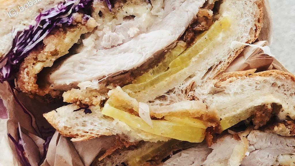 Salt & Pepper Fried Chicken Sandwich · Double fried chicken, 5 pieces salt seasoning, citrus aioli, cabbage takuan. Comes with citrus aioli, takuan, and cabbage slaw.