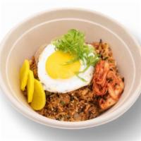 Kimchi Fried Rice · Rice, homemade kimchi, gochujang, pork belly, furikake, sunny side up egg.