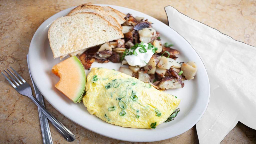 Greek Omelet · Spinach, Feta cheese, green onions, kalamata olives and scallions.