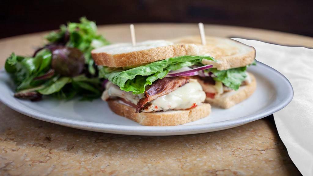Chicken Club · Grilled chicken breast with crisp bacon, avocado, tomato and melted Swiss cheese.