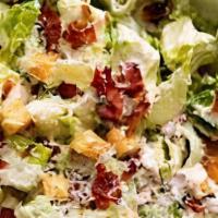 Caesar Salad · Crisp romaine lettuce lightly tossed with home-made Caesar dressing, grilled chicken and Par...
