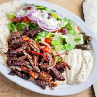 Shalaby Steak · Strips of flank steak seasoned with Mediterranean spices, bell peppers, cherry tomatoes and ...