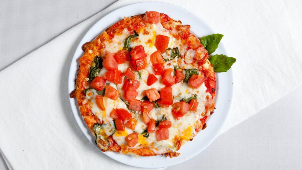 Margherita Pizza · Classic red sauce, garlic, tomatoes, basil and olive oil.