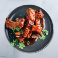 Sticky Ribs · pan-glazed Korean-style pork ribs, sesame seeds, scallions, spicy cucumber banchan
