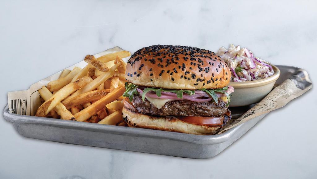 WestCoast Wagyu Cheeseburger · a la carte 6 oz natural Wagyu beef, cooked medium (pink inside), white cheddar, tomato, baby arugula, pickled onions, citrus aioli, sesame slaw on the side