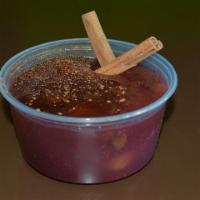 Mazamorra Morada · Purple corn pudding with dry fruits.