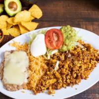 1. HUEVOS CON CHORIZO · Three scrambled eggs with chorizo, served with rice, refried beans & tortillas.