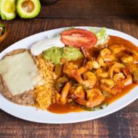 28. CAMARONES RANCHEROS · Prawns cooked with tomato sauce, onions, tomatoes & bell peppers. Served with rice, beans, &...