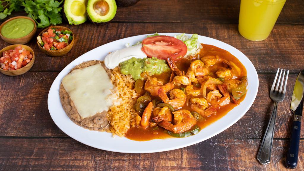 28. CAMARONES RANCHEROS · Prawns cooked with tomato sauce, onions, tomatoes & bell peppers. Served with rice, beans, & tortillas.