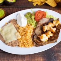 27. CAMARONES CON ASADA · Prawns with a grilled steak, erved with rice, beans, lettuce. Tomato. Avocado & tortillas.