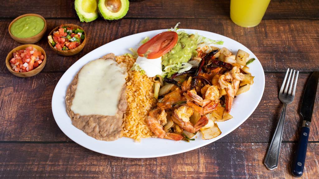 Camarones Al Chile De Arbol · SPECIAL. Spicy prawns cooked with Chile de arbol peppers served with rice, beans, lettuce, tomato, avocado, sour cream & tortillas.