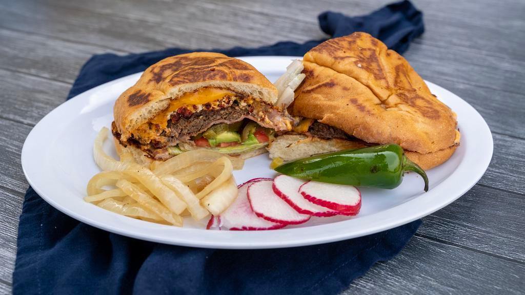 Torta Regular · Telera bread fill with mayo, lettuce, tomatoes, avocado, jalapenos, cheese, salsa, chipotle mayo and your choice of meat.