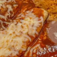 (2) Tacos (1) Enchilada · two tacos (choice of meat) and enchilada (choice of meat) , served with rice and beans.