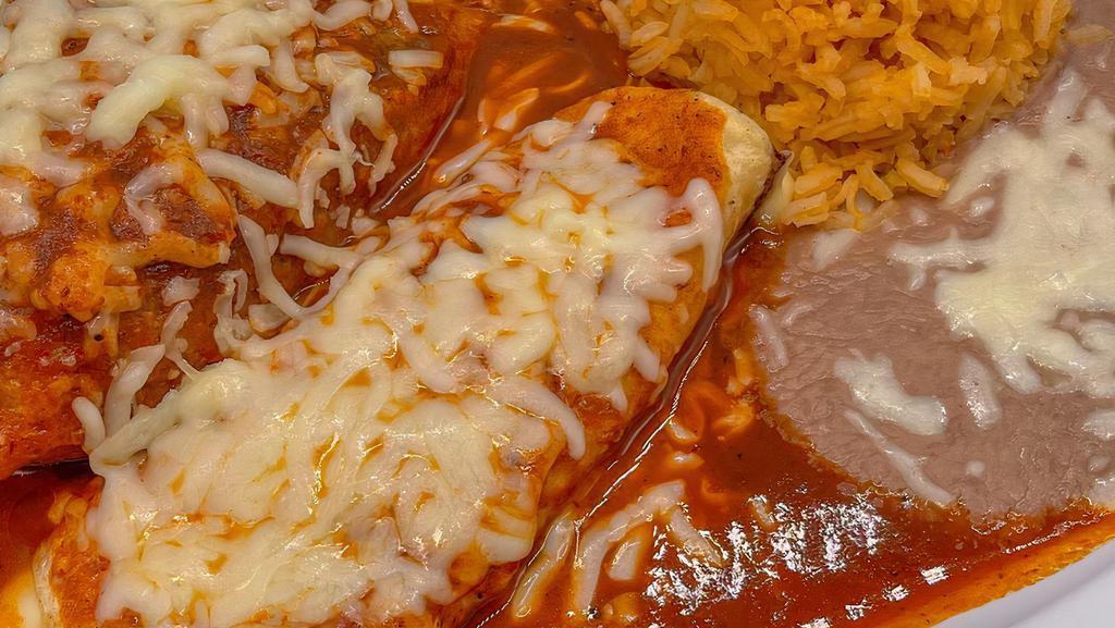 (2) Tacos (1) Enchilada · two tacos (choice of meat) and enchilada (choice of meat) , served with rice and beans.
