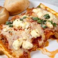 Beef Lasagna · Traditional lasagna with layers of ground beef, prosciutto and bolognese sauce with Parmesan...