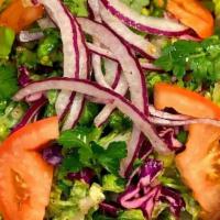House Salad · Arugula, lettuce and cabbage salad, red onion, tomatoes