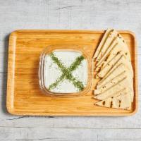 Tzatziki · Greek yogurt with English cucumber, topped with olive oil, served with pita or veggies