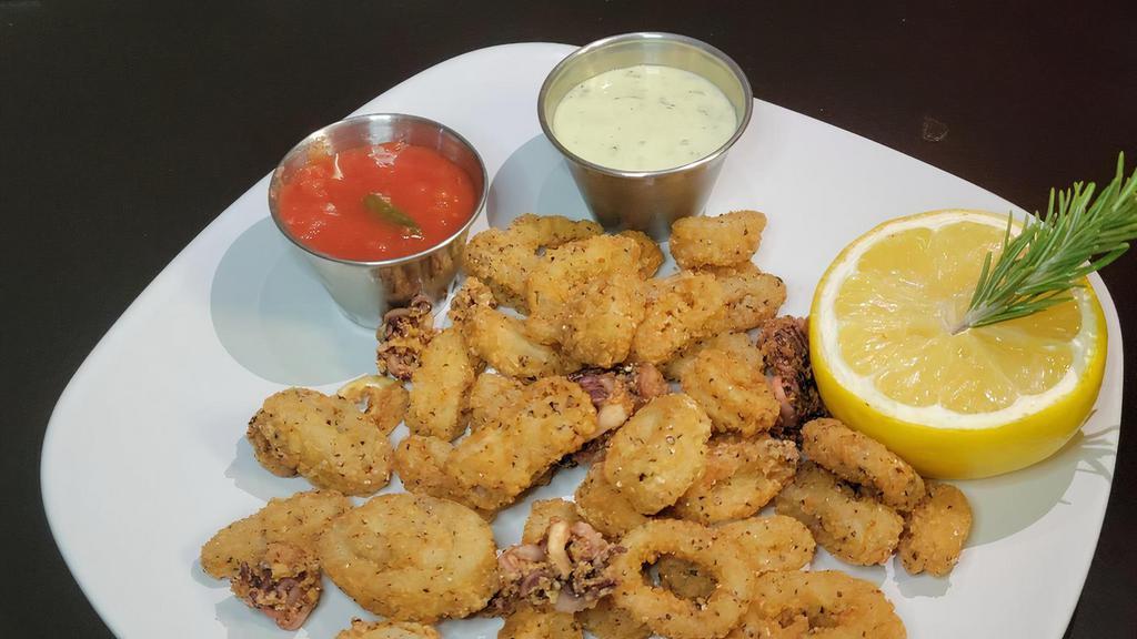 Fried Calamari · Fried Light and Crisp. Served with Garlic dip and Marinara sauce.