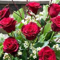 Roses · One dozen roses with wax flower and  assorted greens. Rose color choices: red, white, pink ,...