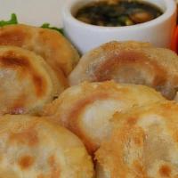 Pot Sticker · Steam fried, handmade dumplings with tofu, soy protein, ginger, shiitake, cabbage, carrot, a...