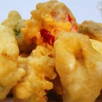 Japanese Tempura · Deep fried mixed vegetables served with a mildly spicy dipping sauce with green onion.