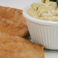 Middle Eastern Hummus · Chickpeas with sesame tahini, garlic and spices; served with pita bread.