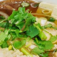 Pho · Thin rice noodles, soy protein, mushroom, onion, tofu, bean sprouts, basil, and herbs in a f...