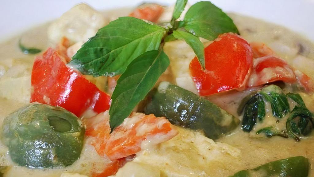 Thai Green Curry · Tofu, Thai eggplant, cauliflower, carrot, bell pepper, mushroom, lime leaf, and basil in a Thai green curry with coconut milk (gluten-free).