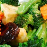 Broccoli Shiitake Tofu · Stir-fried broccoli, tofu, carrot and shiitake mushroom in a light mushroom sauce with onion...