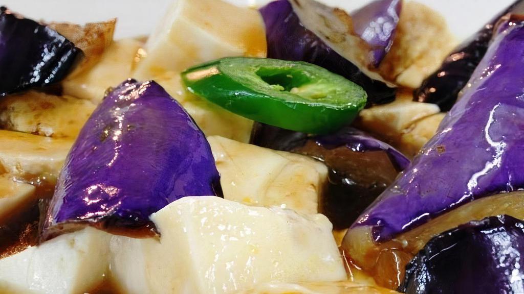 Eggplant Tofu · Fresh tofu with eggplant, sautéed in a spiced mushroom sauce with onion (gluten-free).