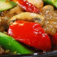 Dancing Asparagus · Fresh asparagus with soy protein, red bell pepper, mushroom, garlic, onion, and spiced sauce...