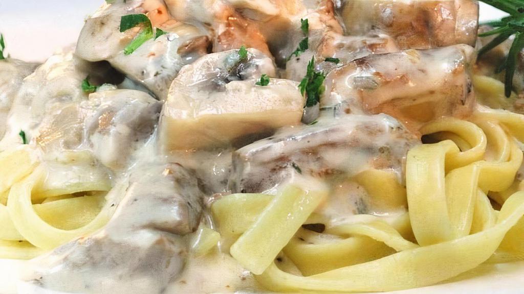 Stroganoff · Fettuccine in a creamy white sauce with soy protein, mushroom, onions & garlic; served with bread and vegan butter (Gluten-free option).