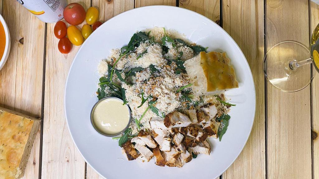 Kale Ceasar · Organic baby kale, herb roasted chicken breast, parmesan cheese, toasted garlic breadcrumbs, caesar dressing. Serve with sliced organic Acme bread.