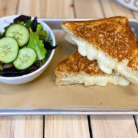Classic Grilled Cheese · Fontina, aged sharp white cheddar, toasted organic Acme pan de Mei. Serve with side salad (v...