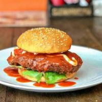 Buffalo Chicken Burger · Classic chicken burger topped with spicy buffalo sauce, fresh lettuce, cheese, tomatoes, and...