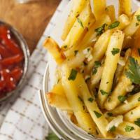 Garlic Fries · Hand cut french fries covered and smothered in garlic.